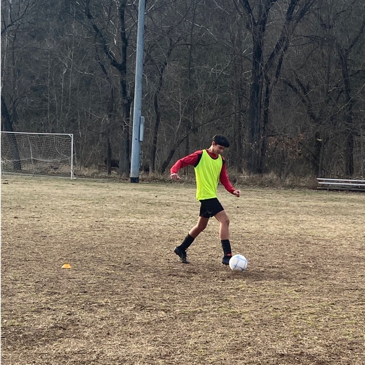 student playing soccer
