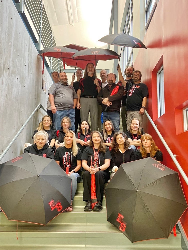 staff with umbrellas 