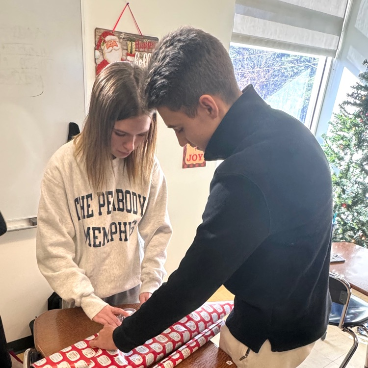 students wrapping gifts 
