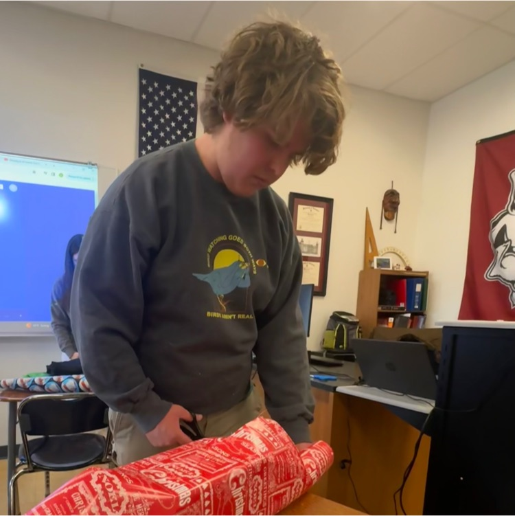students wrapping gifts 